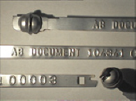 Goedgekeurde stalen bandverzegeling met alfanumeriek identificatiekenmerk AB DOCUMENT  104341