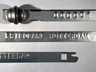 Goedgekeurde stalen bandverzegeling met alfanumeriek identificatiekenmerk FRIGOCARE ROTTERDAM