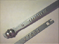 Goedgekeurde stalen bandverzegeling met alfanumeriek identificatiekenmerk TRANSALKIM