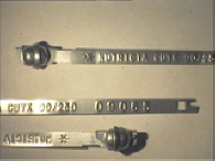 Goedgekeurde stalen bandverzegeling met alfanumeriek identificatiekenmerk NUTRICIA CUYK 90/250