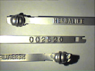 Goedgekeurde stalen bandverzegeling met alfanumeriek identificatiekenmerk HERBALIFE