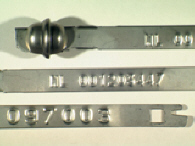 Goedgekeurde stalen bandverzegeling met alfanumeriek identificatiekenmerk NL001239314