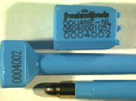 Goedgekeurde bolt seal met alfanumeriek identificatiekenmerk FRIESLAND FOODS DOUANE-NL 06040001057