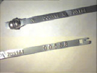 Goedgekeurde stalen bandverzegeling met numeriek identificatiekenmerk 705164